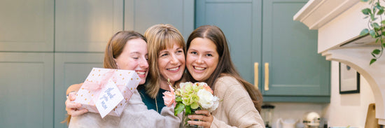 Mother celebrating with her daughters